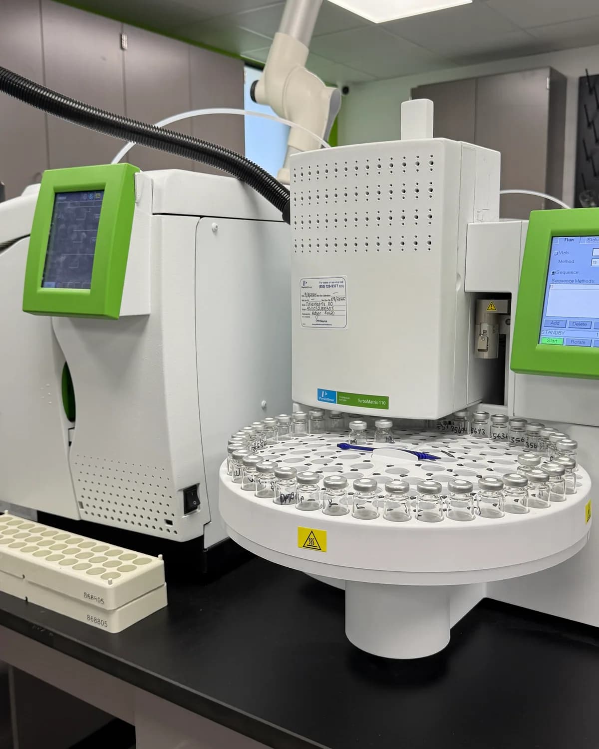 A gas chromatograph autosampler carousel loaded with vials